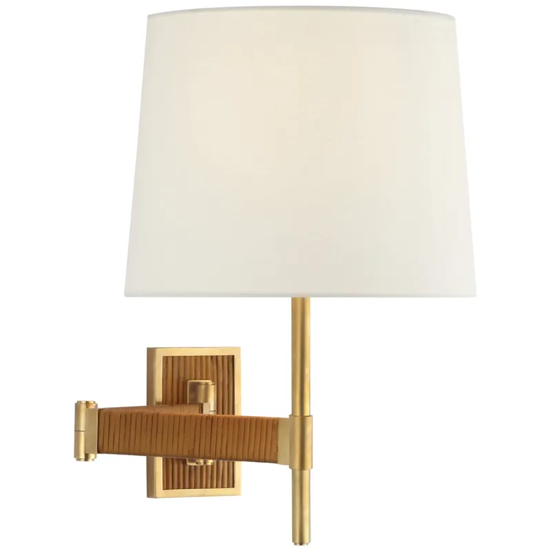 Suzanne Kasler Elle Swing Arm Sconce in Hand-Rubbed Antique Brass and Dark Rattan with Linen Shade Wall Light W16.75" x H17.25"